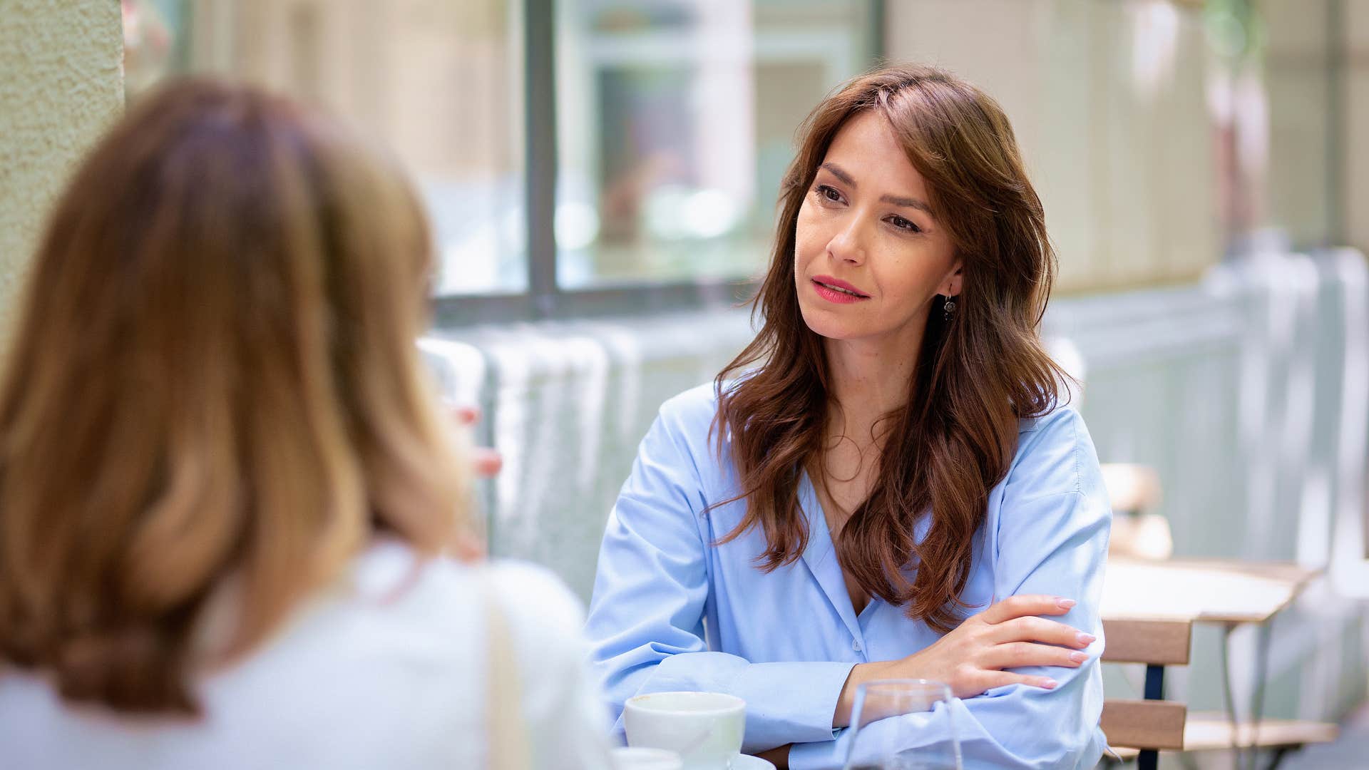 high iq woman talking to friend upset over her conforming